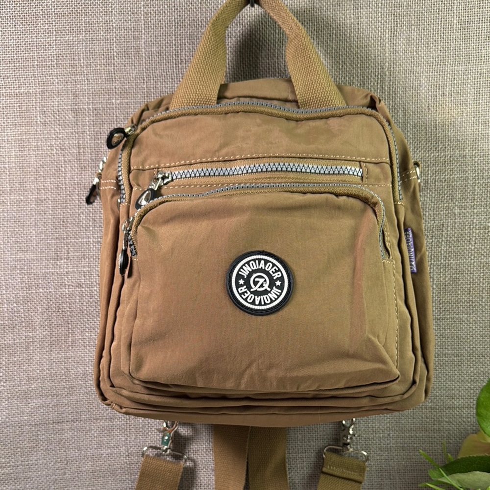 Jinqiaoer Tan unisex Backpack new never been used.